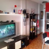 One-Bedroom Apartment. Living area with sofa, large TV and international programs - 1
